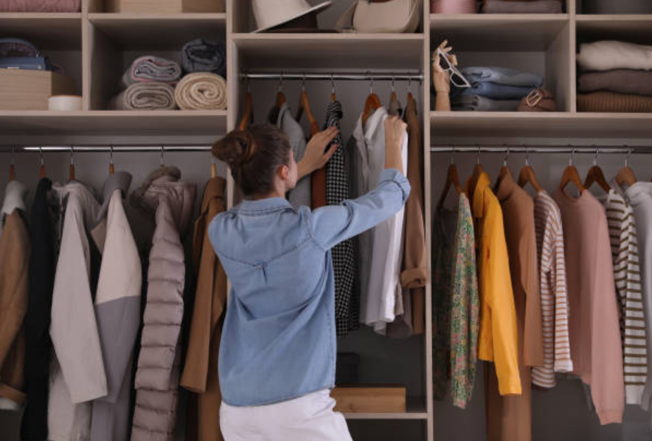 A structured coat hanging on a wooden hanger